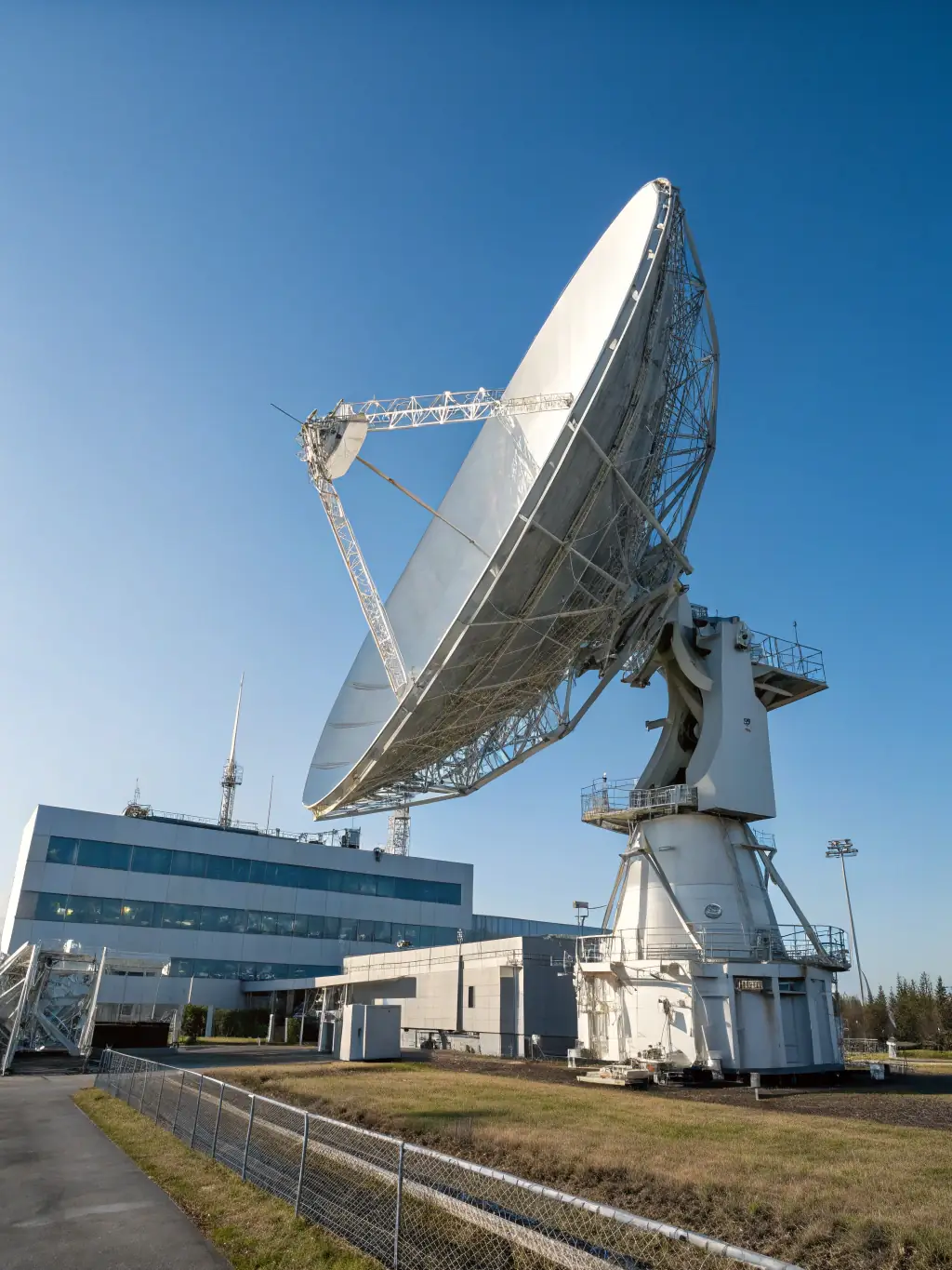 An image of a satellite dish communicating with IoT sensors in a remote agricultural field, illustrating the integration of satellite IoT solutions for smart agriculture.